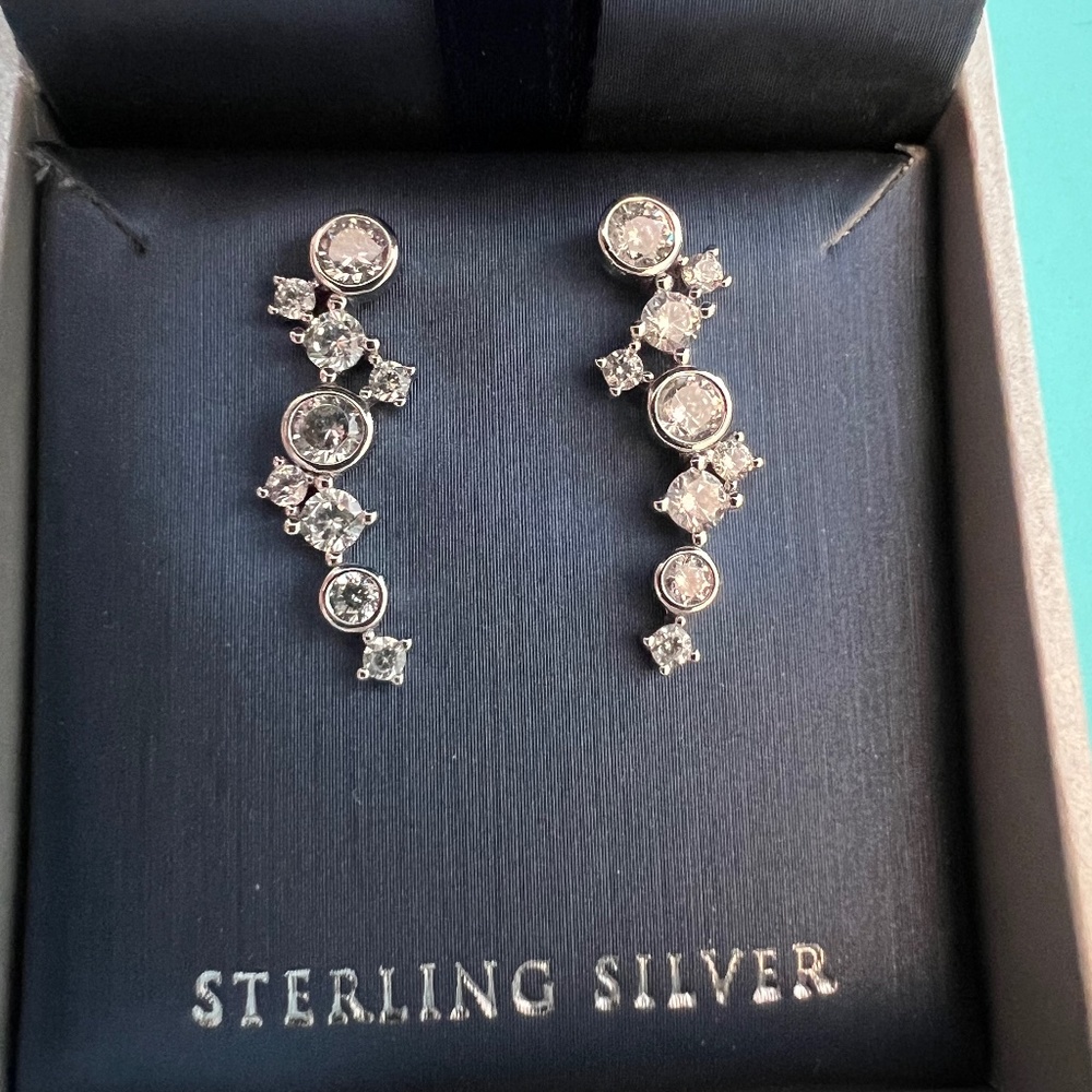 Silver earrings with clear cz stones.  One inch long.  Post style.